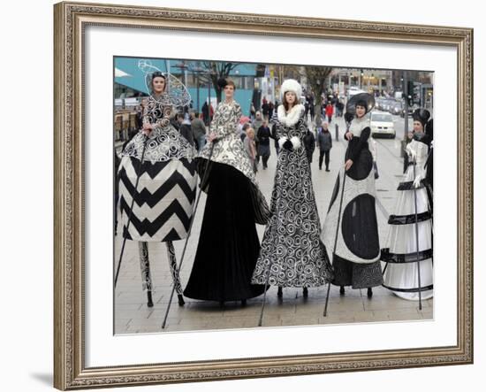 Models on Stilts Present "High Fashion" on the Famous "Jungfernstieg" Boulevard in Hamburg, Germany-null-Framed Photographic Print