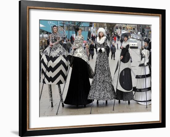 Models on Stilts Present "High Fashion" on the Famous "Jungfernstieg" Boulevard in Hamburg, Germany-null-Framed Photographic Print