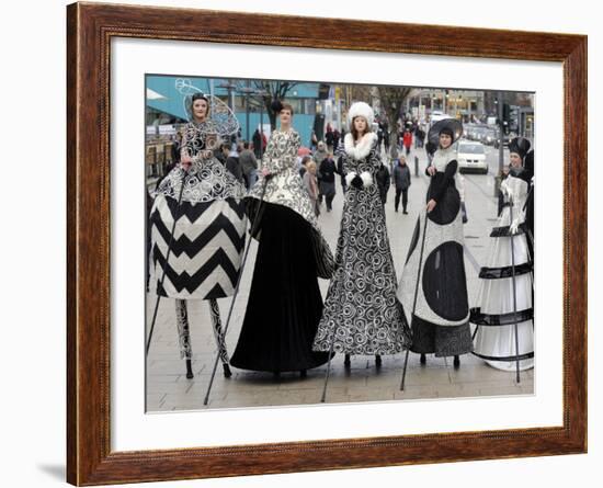 Models on Stilts Present "High Fashion" on the Famous "Jungfernstieg" Boulevard in Hamburg, Germany-null-Framed Photographic Print