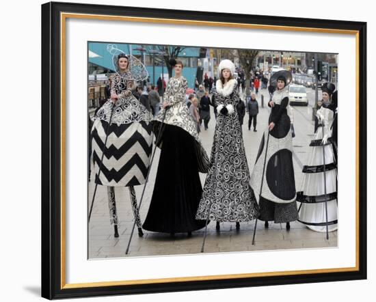 Models on Stilts Present "High Fashion" on the Famous "Jungfernstieg" Boulevard in Hamburg, Germany-null-Framed Photographic Print