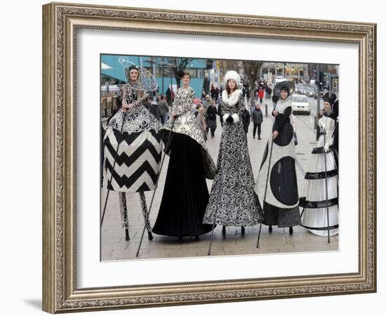 Models on Stilts Present "High Fashion" on the Famous "Jungfernstieg" Boulevard in Hamburg, Germany-null-Framed Photographic Print