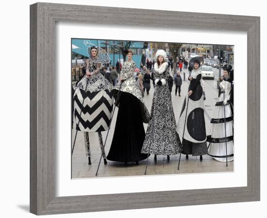 Models on Stilts Present "High Fashion" on the Famous "Jungfernstieg" Boulevard in Hamburg, Germany-null-Framed Photographic Print