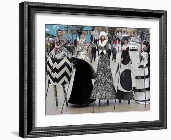 Models on Stilts Present "High Fashion" on the Famous "Jungfernstieg" Boulevard in Hamburg, Germany-null-Framed Photographic Print