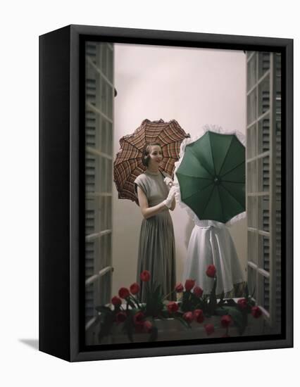 Models Posing with Umbrellas in a Macy's Department Store Display, New York, NY, 1948-Nina Leen-Framed Premier Image Canvas