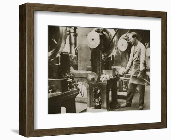 Money making; cutting strips of silver into disks, 20th century-Unknown-Framed Photographic Print