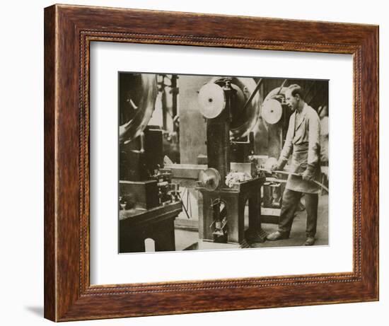 Money making; cutting strips of silver into disks, 20th century-Unknown-Framed Photographic Print