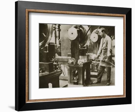 Money making; cutting strips of silver into disks, 20th century-Unknown-Framed Photographic Print