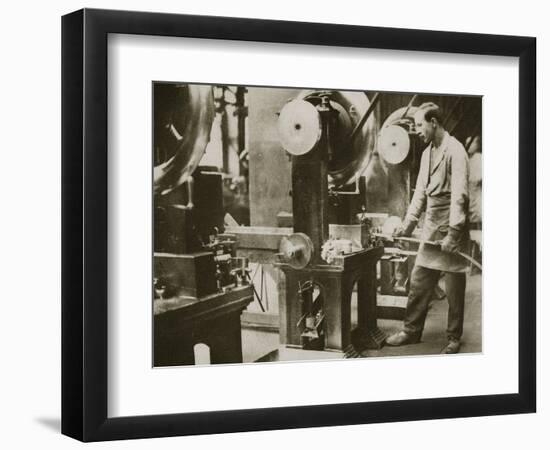 Money making; cutting strips of silver into disks, 20th century-Unknown-Framed Photographic Print