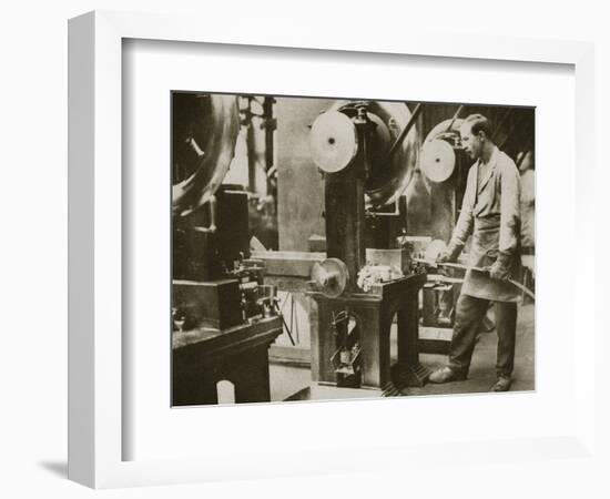 Money making; cutting strips of silver into disks, 20th century-Unknown-Framed Photographic Print