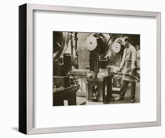 Money making; cutting strips of silver into disks, 20th century-Unknown-Framed Photographic Print