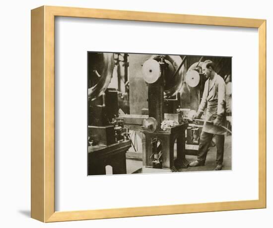 Money making; cutting strips of silver into disks, 20th century-Unknown-Framed Photographic Print