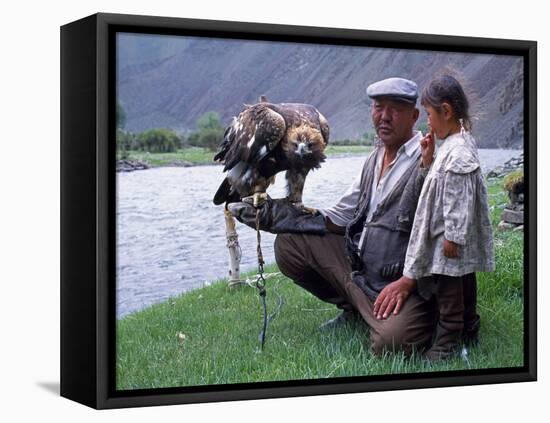 Mongolia, Kasakh Hunter with Eagle by the Khovd River, with a Small Child-Antonia Tozer-Framed Premier Image Canvas