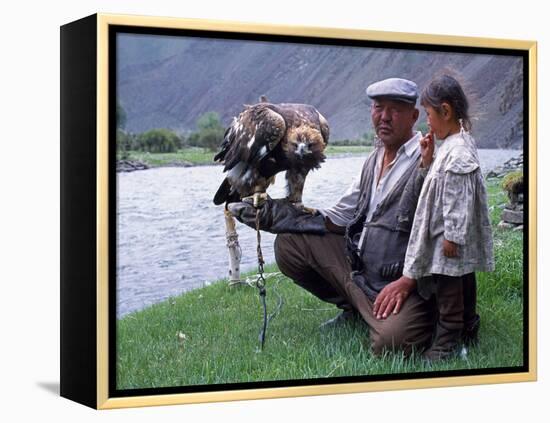 Mongolia, Kasakh Hunter with Eagle by the Khovd River, with a Small Child-Antonia Tozer-Framed Premier Image Canvas