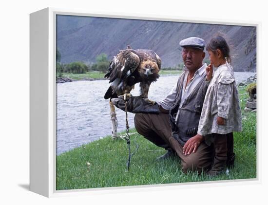 Mongolia, Kasakh Hunter with Eagle by the Khovd River, with a Small Child-Antonia Tozer-Framed Premier Image Canvas