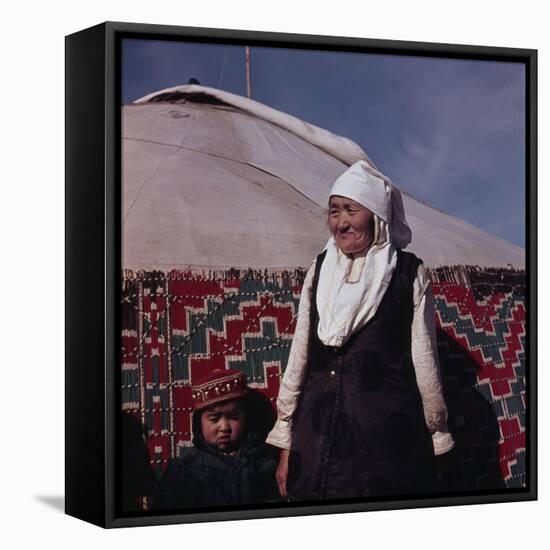 Mongolian woman in front of her yurt-Werner Forman-Framed Premier Image Canvas