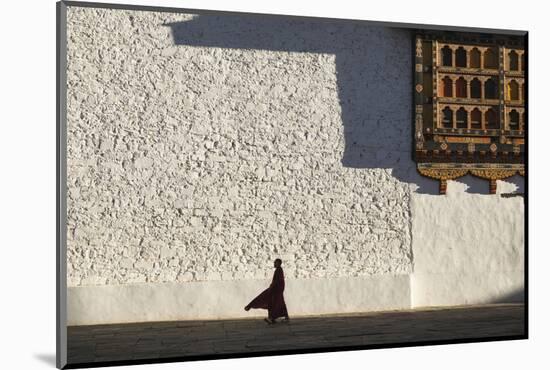 Monk walks through the courtyard of Rinpung Dzong Monastery, Bhutan.-Brenda Tharp-Mounted Photographic Print