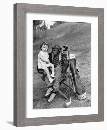 Monkey with Golf Clubs and Toddler Girl-null-Framed Photo