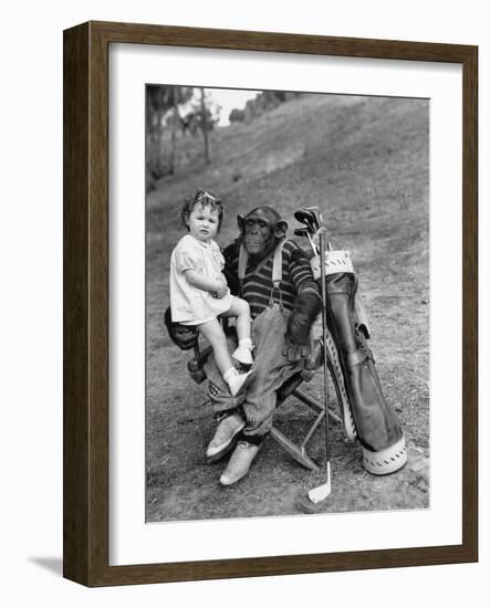Monkey with Golf Clubs and Toddler Girl-null-Framed Photo
