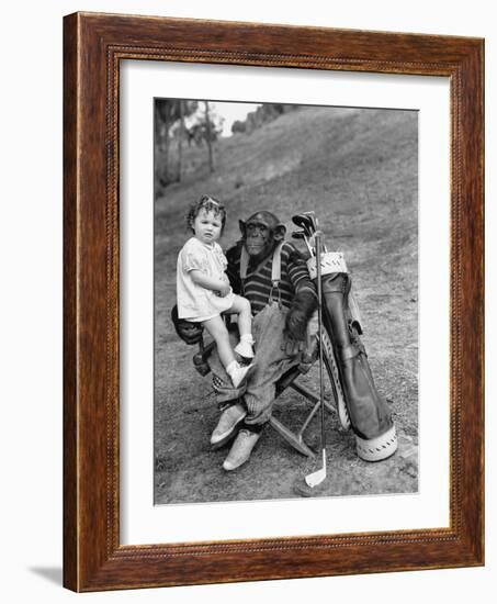 Monkey with Golf Clubs and Toddler Girl-null-Framed Photo