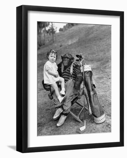 Monkey with Golf Clubs and Toddler Girl-null-Framed Photo