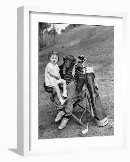 Monkey with Golf Clubs and Toddler Girl-null-Framed Photo