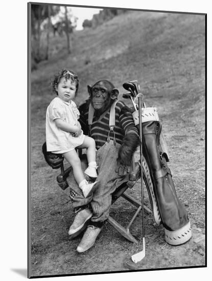 Monkey with Golf Clubs and Toddler Girl-null-Mounted Photo