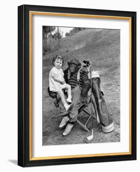 Monkey with Golf Clubs and Toddler Girl-null-Framed Photo