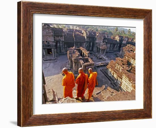 Monks Overlook Angkor Wat, Cambodia-Tom Haseltine-Framed Photographic Print