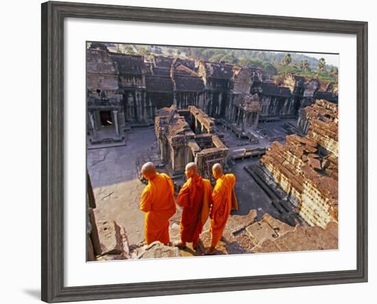 Monks Overlook Angkor Wat, Cambodia-Tom Haseltine-Framed Photographic Print