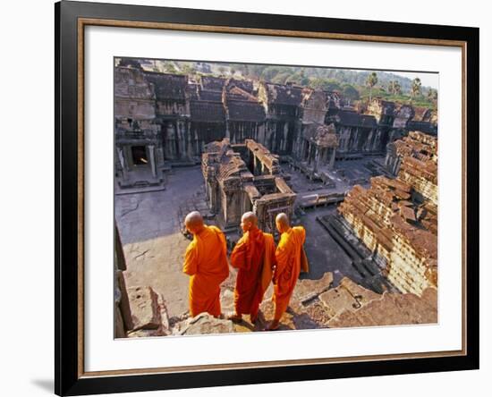 Monks Overlook Angkor Wat, Cambodia-Tom Haseltine-Framed Photographic Print