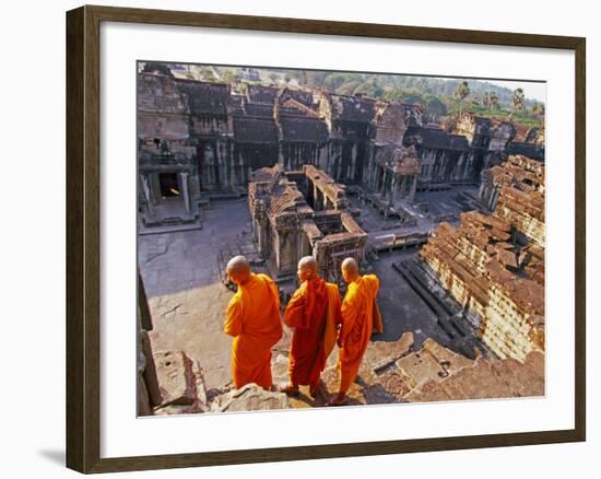 Monks Overlook Angkor Wat, Cambodia-Tom Haseltine-Framed Photographic Print