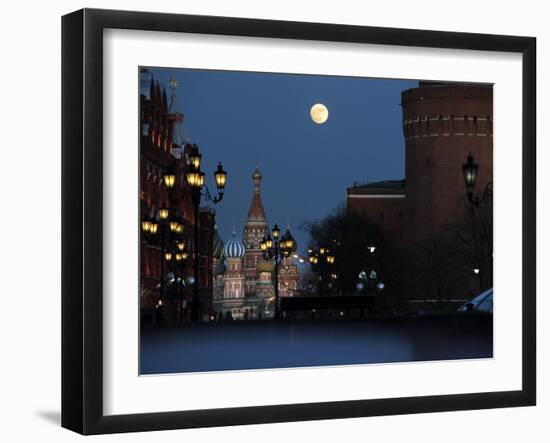 Moon is Seen over the Red Square in Moscow with the St. Basil Cathedral in the Background-null-Framed Photographic Print