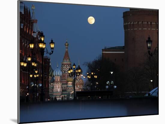 Moon is Seen over the Red Square in Moscow with the St. Basil Cathedral in the Background-null-Mounted Photographic Print