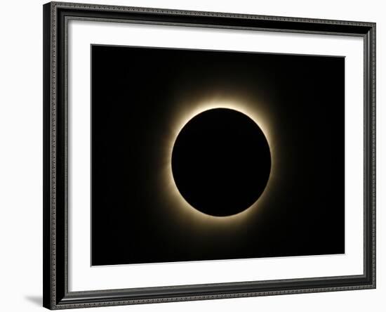 Moon Passes Between the Sun and the Earth During a Total Solar Eclipse in Varanasi, India-null-Framed Photographic Print