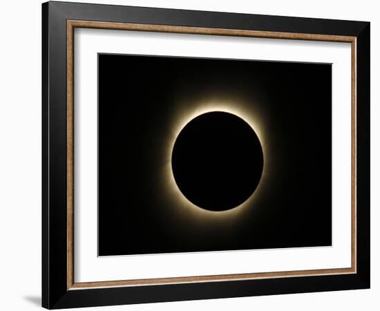 Moon Passes Between the Sun and the Earth During a Total Solar Eclipse in Varanasi, India-null-Framed Photographic Print