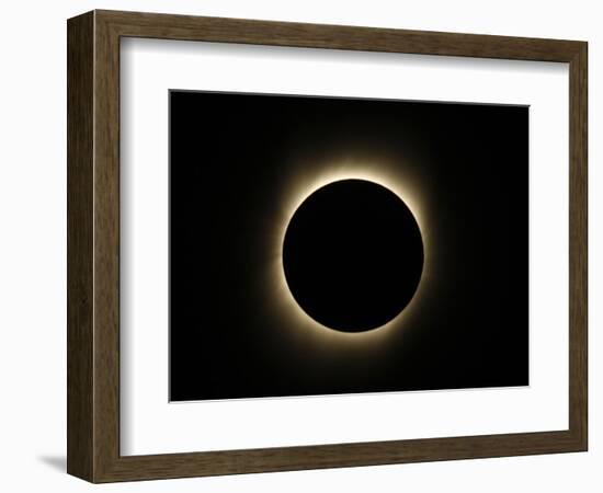 Moon Passes Between the Sun and the Earth During a Total Solar Eclipse in Varanasi, India-null-Framed Photographic Print