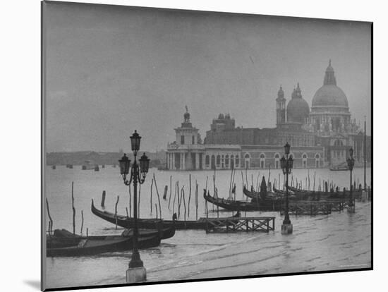 Moored Gondolas in Grand Canal by Flooded Piazza San Marco with Santa Maria Della Salute Church-Dmitri Kessel-Mounted Photographic Print