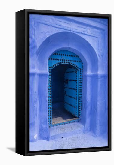 Morocco. A traditional blue doorway in the hill town of Chefchaouen.-Brenda Tharp-Framed Premier Image Canvas