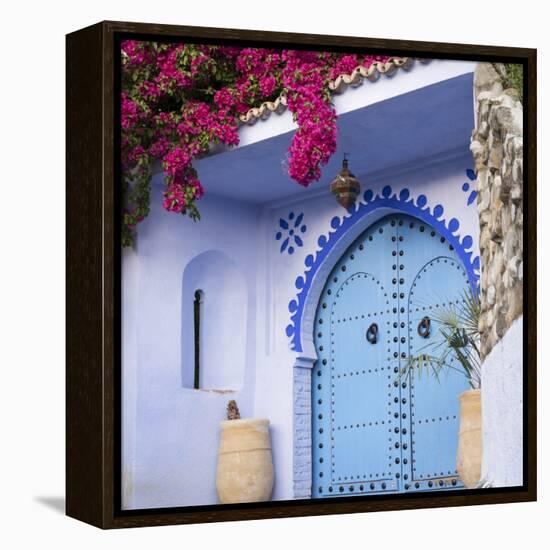 Morocco, Chefchaouen. Bougainvillea Blossoms Frame an Ornate Blue Door-Brenda Tharp-Framed Premier Image Canvas