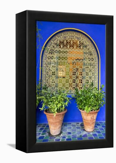 Morocco, Marrakech, Blue Building Exterior Surrounded by Plants-Emily Wilson-Framed Premier Image Canvas