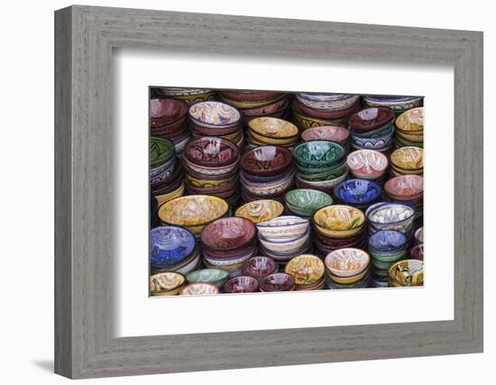 Morocco, Marrakech. Colorfully painted ceramic bowls for sale in a souk, a shop.-Brenda Tharp-Framed Photographic Print