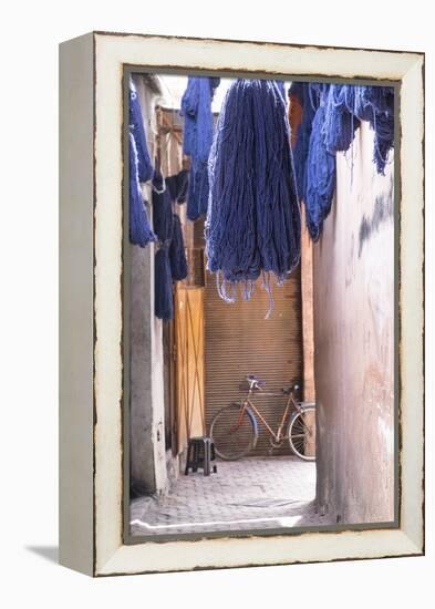 Morocco, Marrakech. Jemaa El Fnaa. Dyed Yarn Hanging to Dry-Emily Wilson-Framed Premier Image Canvas