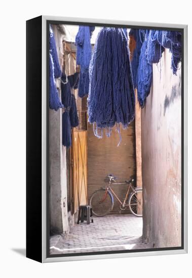 Morocco, Marrakech. Jemaa El Fnaa. Dyed Yarn Hanging to Dry-Emily Wilson-Framed Premier Image Canvas