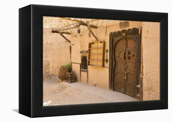Morocco, South of Morocco, Traditionally Carved Wood Door at Tamnougalt Kasbah in the Draa Valley-Emily Wilson-Framed Premier Image Canvas