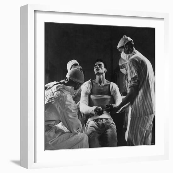 Mortar Wounded Army Medic Private George Lott, Sitting Up While 4 Army Surgeons Finish Up His Cast-Ralph Morse-Framed Photographic Print