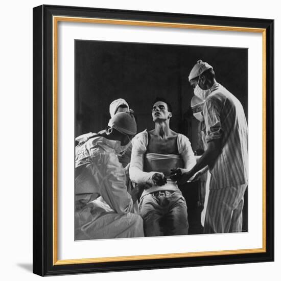 Mortar Wounded Army Medic Private George Lott, Sitting Up While 4 Army Surgeons Finish Up His Cast-Ralph Morse-Framed Photographic Print