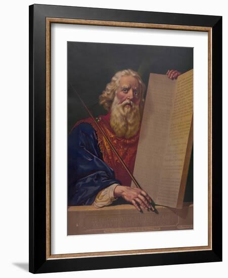 Moses holding the tablets inscribed with the Ten Commandments.-Stocktrek Images-Framed Art Print