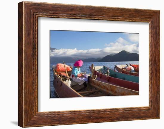 Mosu woman on boat, Luoshui, Lugu Lake, Yunnan, China, Asia-Ian Trower-Framed Photographic Print