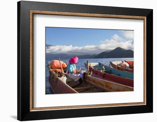 Mosu woman on boat, Luoshui, Lugu Lake, Yunnan, China, Asia-Ian Trower-Framed Photographic Print