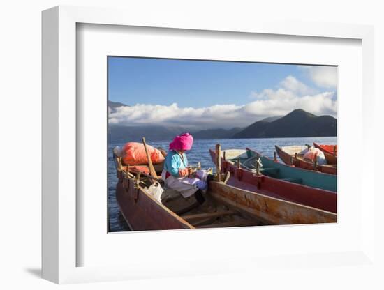 Mosu woman on boat, Luoshui, Lugu Lake, Yunnan, China, Asia-Ian Trower-Framed Photographic Print